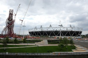 Final touches being made with safety gloves to Olympic village